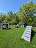 Charming pet-friendly playground featuring vibrant agility structures and lush green grass, perfect for outdoor fun.