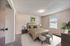 Cozy and inviting bedroom with elegant decor, featuring a plush bed and stylish nightstands in a sunlit space.