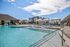 Sparkling Pool Area with Sun Deck