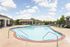 Refreshing Swimming Pool with Sundeck and Lounge Chairs