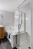 Stylish modern bathroom with glass shower and luxurious bathtub.