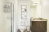 Sleek bathroom featuring a modern vanity, glass-enclosed shower, and elegant decor.