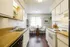 Bright and welcoming kitchen with modern appliances, ample counter space, and cozy dining nook with natural light.