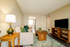 Charming living room with cozy sofa, stylish wooden furniture, and elegant decor, creating a welcoming atmosphere.