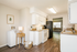 Bright and inviting kitchen with modern appliances, sleek countertops, and wood flooring, perfect for culinary creativity.