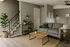Chic living room with modern decor featuring a cozy gray sofa, wooden coffee table, and inviting greenery accents.