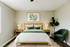 Elegant bedroom featuring a cozy bed with green accents, stylish nightstands, and ambient lighting, complemented by a lush potted plant and inviting artwork.