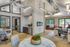 Leasing office with wood floors, large windows, wall art and chairs