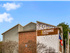 Brick exterior of community with signage