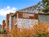 Brick exterior of community with signage