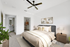 Bed with ceiling fan and closet