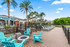 Pool side lounge with fire pit and chairs
