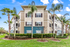 Exterior of apartment building with palm trees