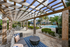 Pool side cabana with table and chairs