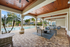 Pool side cabana with table and chairs