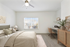 Carpeted bedroom, Bed, ceiling fan, window