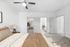 Carpeted bedroom, Bed, ceiling fan, lamp and closet