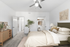 Carpeted bedroom, Bed, ceiling fan, lamp and closet