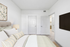 Bed with side lamp and carpet