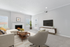 Living room with couch, table, chair and fireplace
