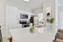 Modern kitchen featuring stainless-steel appliances, and a white quartz countertop.