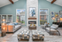 Leasing office with seating area, cushioned chairs , couch and fire place