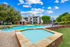 Dual pool feature with sundeck and lounge chairs