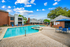 Dual pool feature with sundeck and lounge chairs