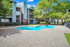 Pool with sundeck surrounded by trees