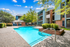 Pool with sundeck surrounded by trees