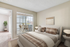 Carpeted bedroom with king size bed and flat screen TV, large window