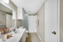 Bathroom with granite counters and hard-wood floors