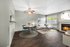 Dining room wooden floor, ceiling fan, white sectional couch