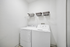Utility room with full size washer and dryer