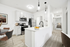 Kitchen with vinyl floors, stainless-steel appliances, white quartz countertop, and pendant lighting