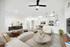 Couch, ceiling fan, and table