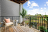 Balcony with railing and patio furniture