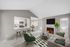 Carpeted living room with ceiling fan, TV, and fireplace