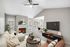 Virtual staging of living room and dining room with carpeted flooring