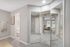 Carpeted bedroom with wall length mirror close doors