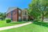 building exterior with green bushes