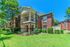 building exterior with green bushes
