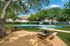 Basket ball court and seating area and trees