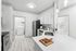 Kitchen with Vinyl floors, stainless-steel appliances, white quartz countertop