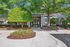Exterior of brick leasing office with landscaping