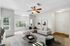 Bright and inviting living room boasting modern decor, plush seating, and large windows with scenic views.