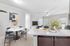 Modern open-concept living space featuring a stylish dining area, elegant kitchen countertop, and cozy living room with natural light.