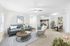 Inviting open-concept living space with stylish furniture, modern kitchen, and cozy dining area, ideal for relaxation and entertainment.