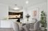 Modern apartment kitchen and dining area with sleek countertops, elegant decor, and abundant natural light, perfect for entertaining.