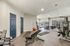 Bright and spacious gym with modern equipment, free weights, and cardio machines, perfect for an invigorating workout.